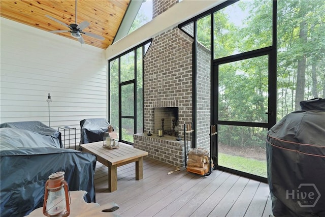 39 Bird Dog Ln, Midway, GA 31320 - sunroom / solarium with a ceiling fan, lofted ceiling, and a fireplace