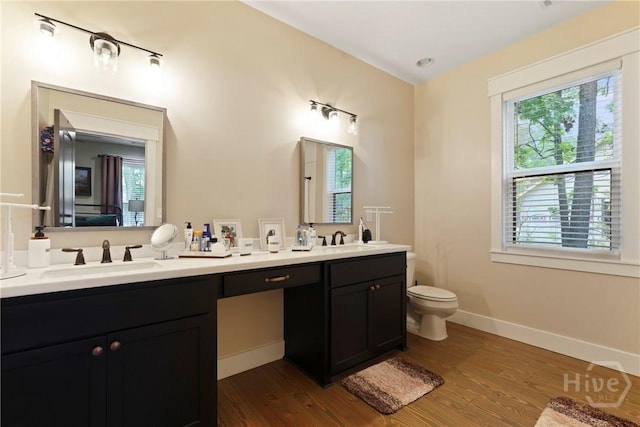 39 Bird Dog Ln, Midway, GA 31320 - full bath featuring double vanity, wood finished floors, toilet, and baseboards
