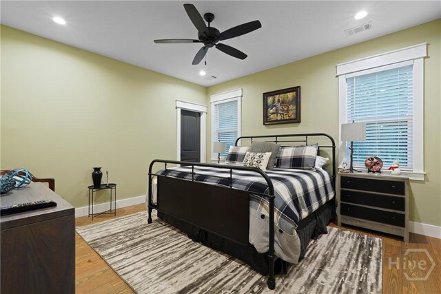 39 Bird Dog Ln, Midway, GA 31320 - bedroom featuring baseboards, wood finished floors, recessed lighting, and a ceiling fan