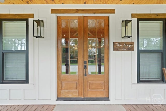 39 Bird Dog Ln, Midway, GA 31320 - doorway to property featuring french doors and board and batten siding
