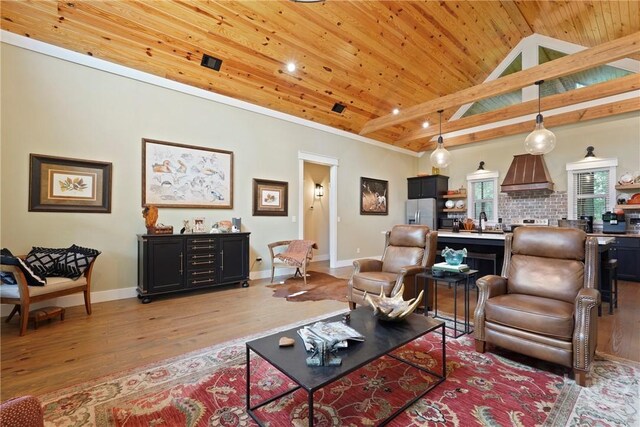 39 Bird Dog Ln, Midway, GA 31320 - living room with light wood-type flooring, wood ceiling, baseboards, and high vaulted ceiling