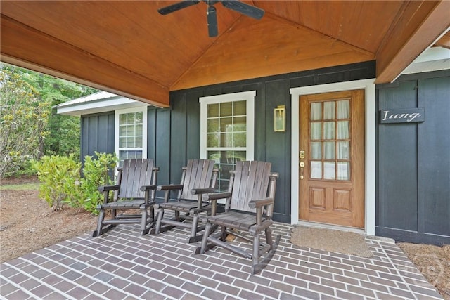 152 Covey Rise Pl, Midway, GA 31320 - doorway to property with ceiling fan and board and batten siding