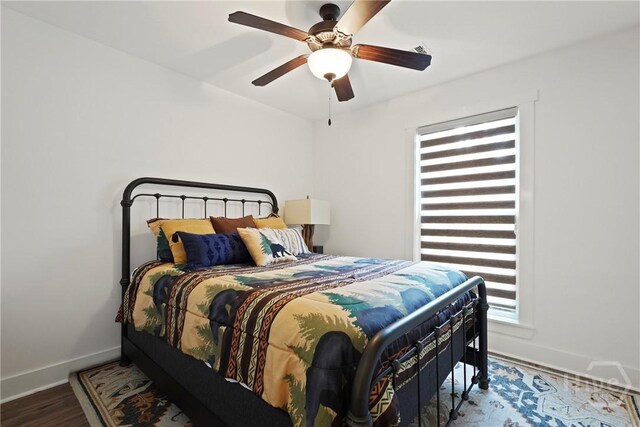 152 Covey Rise Pl, Midway, GA 31320 - bedroom with baseboards, wood finished floors, and a ceiling fan