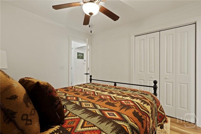 152 Covey Rise Pl, Midway, GA 31320 - bedroom with a closet, a ceiling fan, and light wood-style flooring
