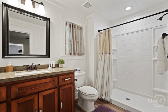 152 Covey Rise Pl, Midway, GA 31320 - bathroom with a shower with shower curtain, vanity, toilet, wood finished floors, and recessed lighting