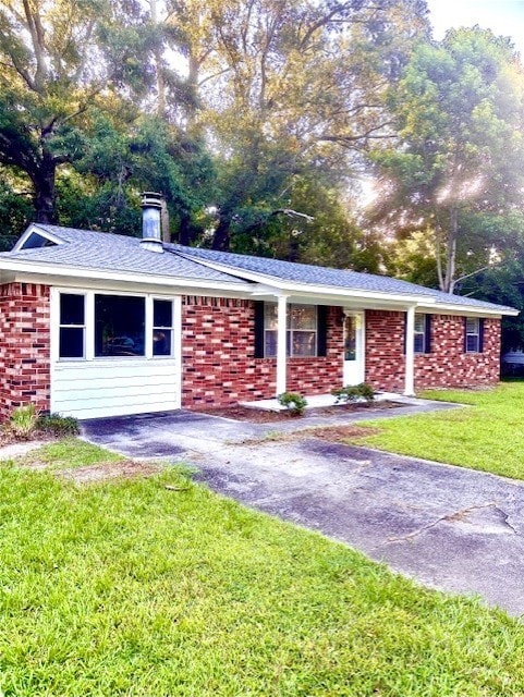 309 Middleton St S, Pooler, GA 31322 - ranch-style home with a front lawn, brick siding, and a chimney