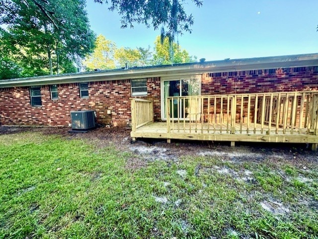 309 Middleton St S, Pooler, GA 31322 - back of house with brick siding, a lawn, a deck, and central air condition unit