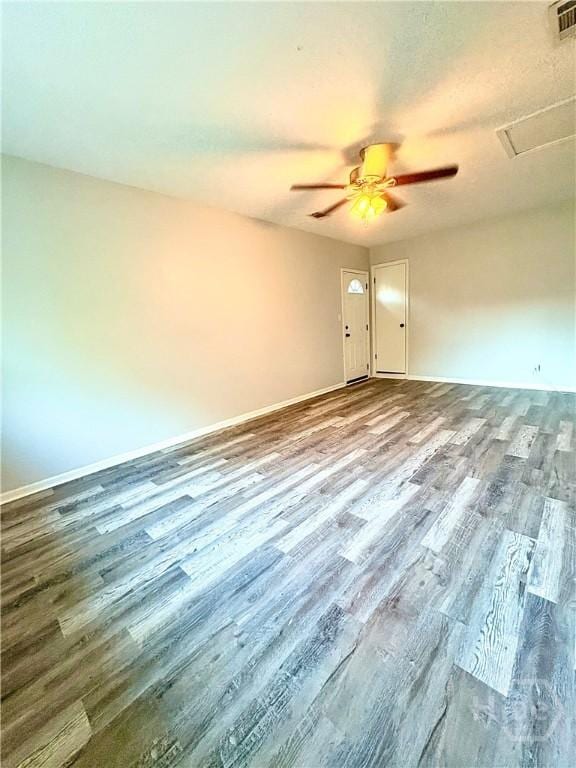 309 Middleton St S, Pooler, GA 31322 - spare room featuring wood finished floors, baseboards, a ceiling fan, and attic access