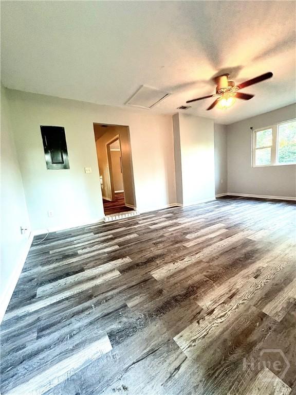 309 Middleton St S, Pooler, GA 31322 - empty room featuring wood finished floors, attic access, ceiling fan, and baseboards
