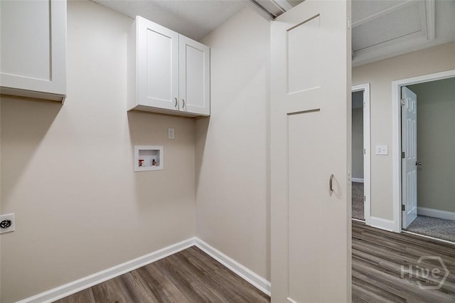 405 E 3rd St, Springfield, GA 31329 - washroom with cabinet space, washer hookup, dark wood-style flooring, electric dryer hookup, and baseboards