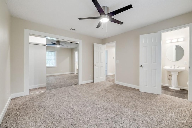 405 E 3rd St, Springfield, GA 31329 - unfurnished bedroom featuring carpet floors, a closet, baseboards, and a ceiling fan