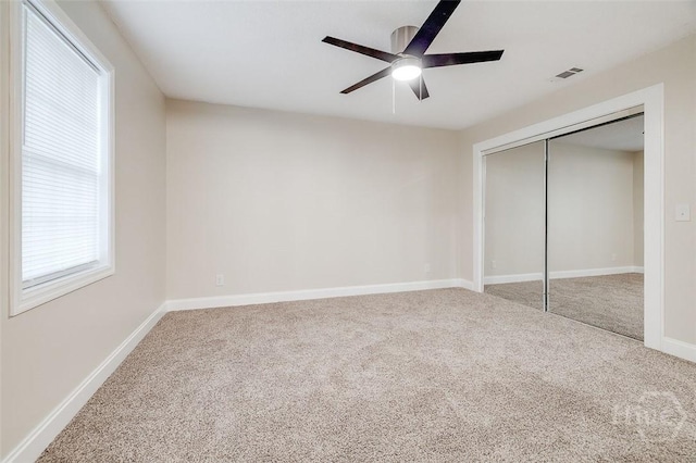 405 E 3rd St, Springfield, GA 31329 - unfurnished bedroom with carpet flooring, baseboards, a closet, and ceiling fan
