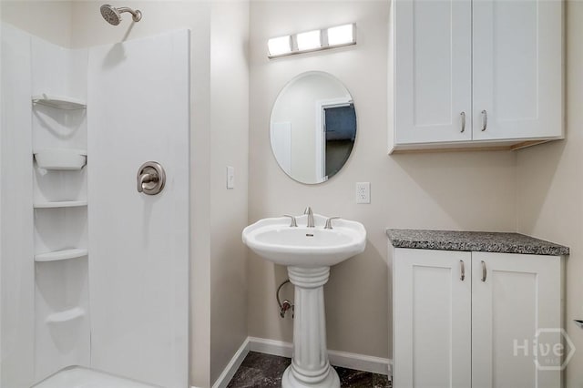405 E 3rd St, Springfield, GA 31329 - bathroom featuring a shower and baseboards