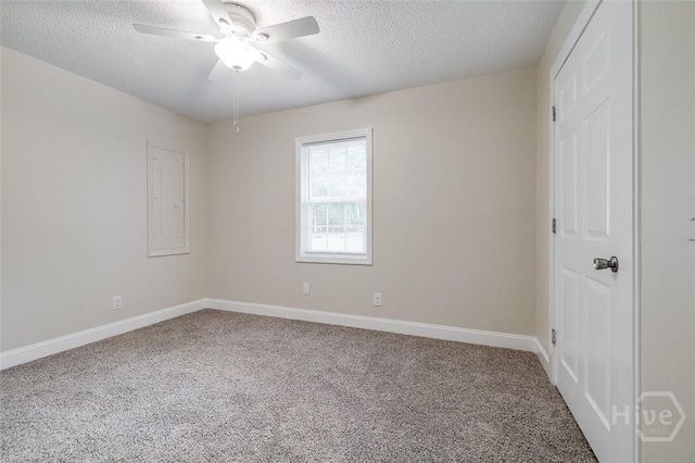 405 E 3rd St, Springfield, GA 31329 - empty room with carpet flooring, ceiling fan, a textured ceiling, and baseboards