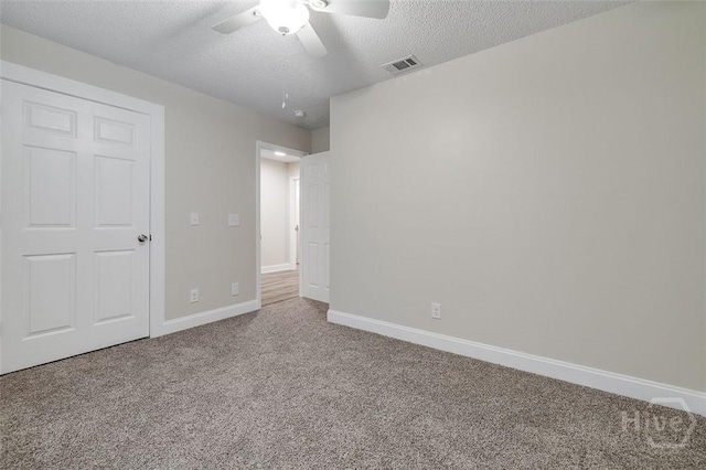 405 E 3rd St, Springfield, GA 31329 - unfurnished bedroom featuring carpet, a textured ceiling, baseboards, and a ceiling fan