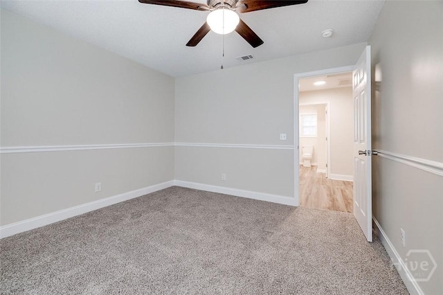 405 E 3rd St, Springfield, GA 31329 - unfurnished room with light carpet, a ceiling fan, baseboards, and a smoke detector