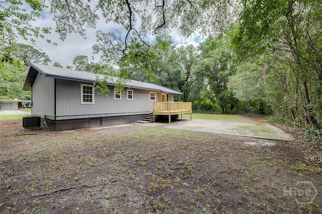 405 E 3rd St, Springfield, GA 31329 - back of property featuring a deck, central AC, and metal roof