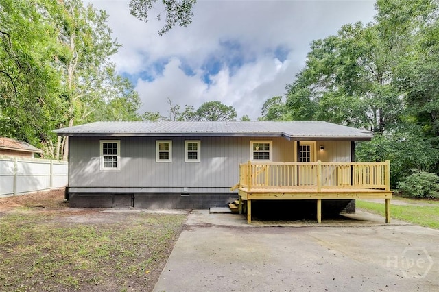 405 E 3rd St, Springfield, GA 31329 - view of front of home featuring crawl space, metal roof, and a deck