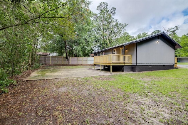 405 E 3rd St, Springfield, GA 31329 - rear view of house with a deck and a patio