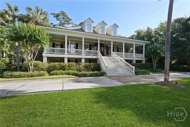 120 Marsh Harbor Dr S, Savannah, GA 31410 - view of front of house featuring covered porch, a front lawn, stairs, and metal roof