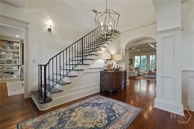 120 Marsh Harbor Dr S, Savannah, GA 31410 - stairs with arched walkways, wood finished floors, ornate columns, a chandelier, and ornamental molding