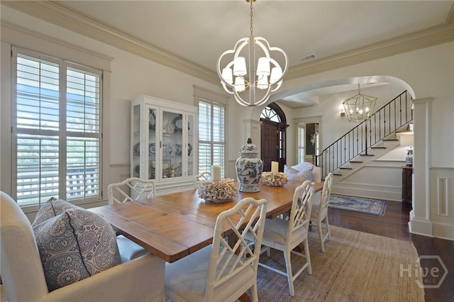 120 Marsh Harbor Dr S, Savannah, GA 31410 - dining room with a chandelier, arched walkways, plenty of natural light, wood finished floors, and ornamental molding