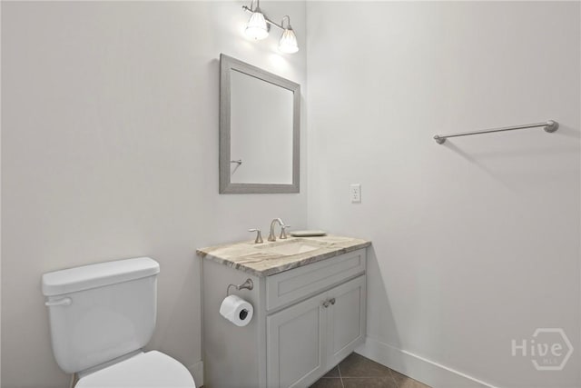 206 Captain Cone Ct, Brooklet, GA 30415 - bathroom featuring vanity, toilet, tile patterned floors, and baseboards