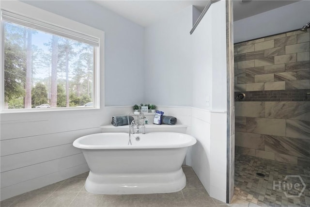 206 Captain Cone Ct, Brooklet, GA 30415 - bathroom with a freestanding bath, tiled shower, tile patterned floors, and wainscoting