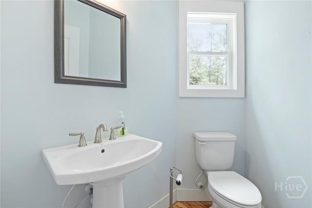 206 Captain Cone Ct, Brooklet, GA 30415 - bathroom with toilet, baseboards, and a sink