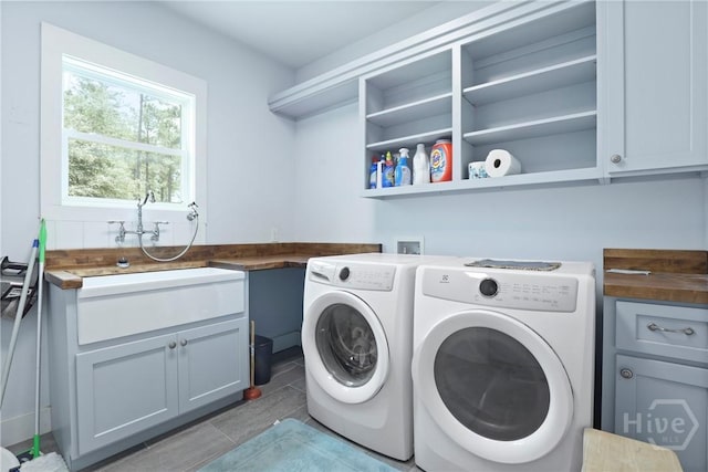 206 Captain Cone Ct, Brooklet, GA 30415 - washroom featuring washing machine and dryer, cabinet space, and tile patterned flooring