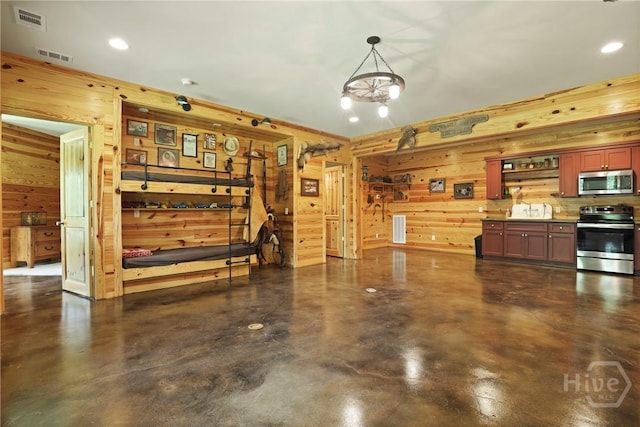 206 Captain Cone Ct, Brooklet, GA 30415 - kitchen with appliances with stainless steel finishes, wooden walls, finished concrete floors, and recessed lighting