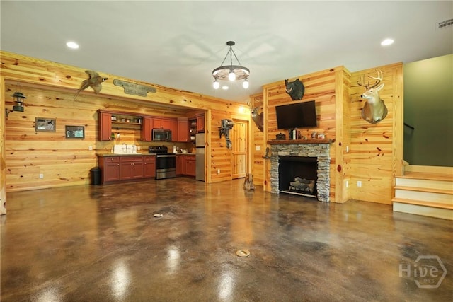 206 Captain Cone Ct, Brooklet, GA 30415 - living room with finished concrete flooring, stairway, wooden walls, a fireplace, and recessed lighting