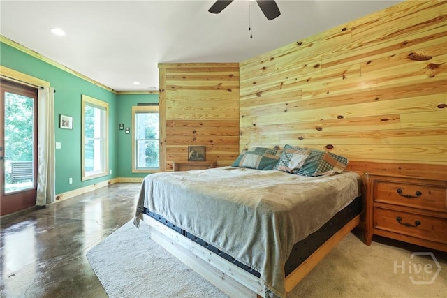 206 Captain Cone Ct, Brooklet, GA 30415 - bedroom featuring finished concrete floors, access to outside, baseboards, wood walls, and ceiling fan