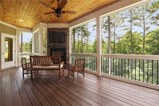 206 Captain Cone Ct, Brooklet, GA 30415 - sunroom with a stone fireplace and a ceiling fan