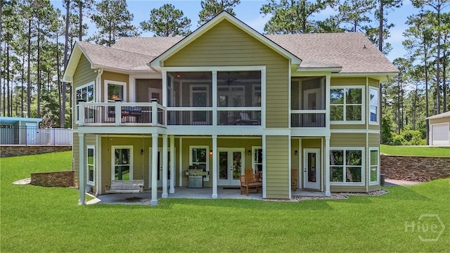 206 Captain Cone Ct, Brooklet, GA 30415 - back of property featuring french doors, roof with shingles, a yard, a sunroom, and a patio