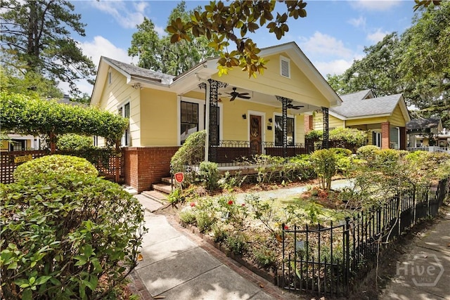 1319 E 39th St E, Savannah, GA 31404 - view of front of home with a ceiling fan, brick siding, and covered porch