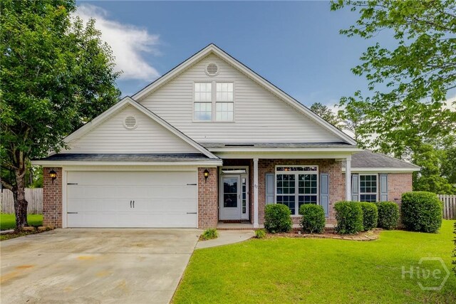 82 Saddlebrush Rd, Ellabell, GA 31308 - view of front of home featuring brick siding, driveway, an attached garage, and roof with shingles