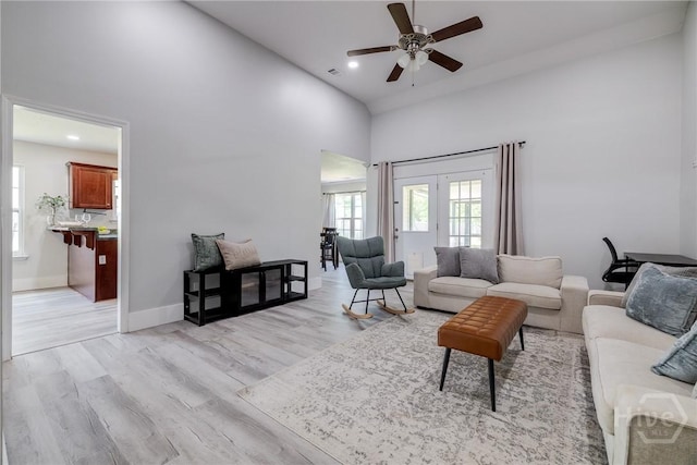 82 Saddlebrush Rd, Ellabell, GA 31308 - living area featuring a towering ceiling, ceiling fan, light wood-type flooring, recessed lighting, and baseboards