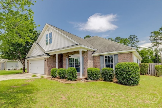 82 Saddlebrush Rd, Ellabell, GA 31308 - view of front facade with driveway, brick siding, and a shingled roof