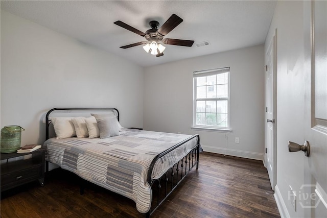 82 Saddlebrush Rd, Ellabell, GA 31308 - bedroom featuring dark wood-type flooring, baseboards, and ceiling fan