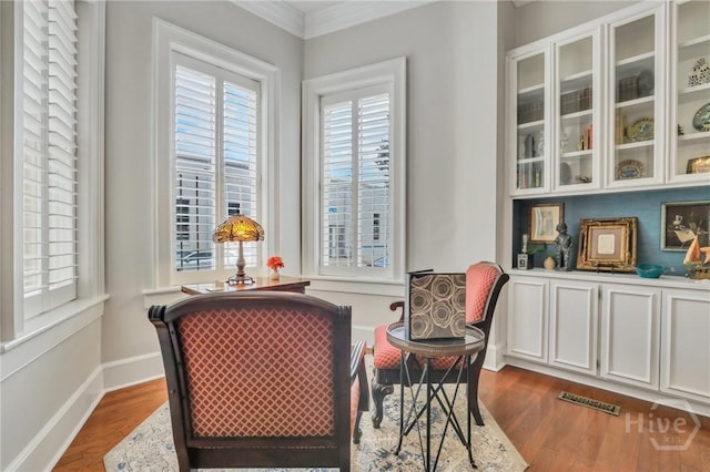 509 E Broughton St, Savannah, GA 31401 - living area featuring wood finished floors and ornamental molding