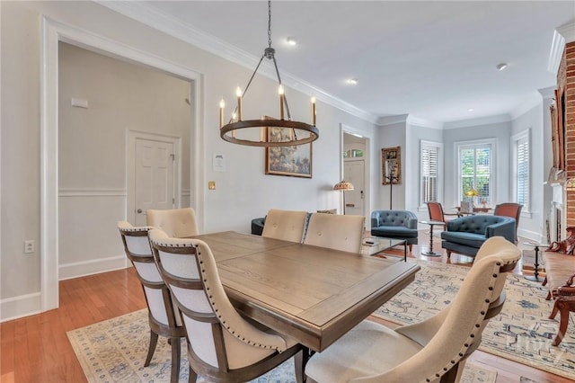 509 E Broughton St, Savannah, GA 31401 - dining area with a chandelier, light wood-style floors, ornamental molding, baseboards, and recessed lighting