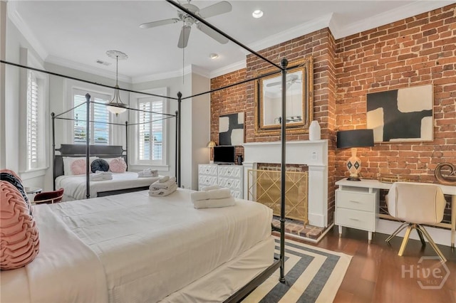 509 E Broughton St, Savannah, GA 31401 - bedroom with crown molding, wood finished floors, and brick wall