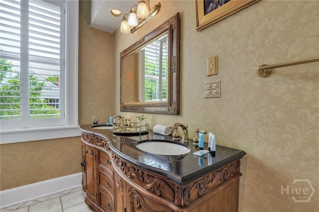 509 E Broughton St, Savannah, GA 31401 - bathroom featuring plenty of natural light, double vanity, baseboards, and tile patterned flooring