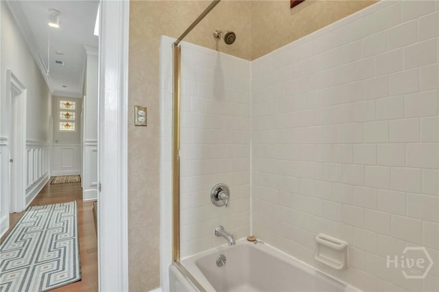 509 E Broughton St, Savannah, GA 31401 - bathroom featuring bathtub / shower combination, wood finished floors, and ornamental molding