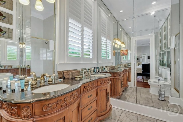 509 E Broughton St, Savannah, GA 31401 - ensuite bathroom featuring double vanity, toilet, marble look tiles, an enclosed shower, and recessed lighting