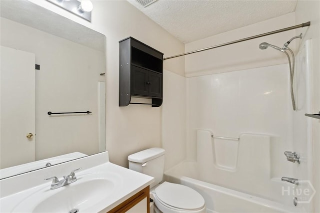 207 Whippoorwill Ln E, Richmond Hill, GA 31324 - full bath featuring vanity, a textured ceiling, toilet, and shower / washtub combination