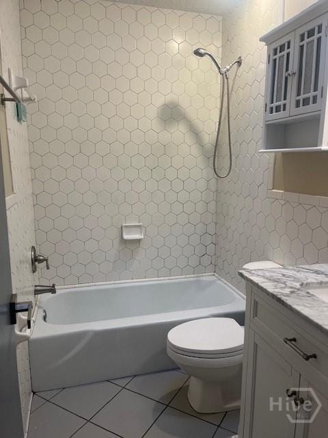 5 Chesterfield Ct, Savannah, GA 31419 - full bathroom featuring vanity, toilet, shower / bathtub combination, tile patterned flooring, and tile walls