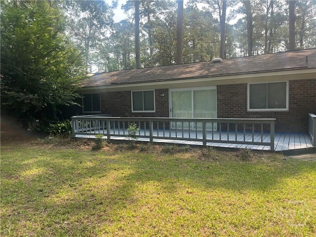 5 Chesterfield Ct, Savannah, GA 31419 - view of front facade featuring brick siding, a wooden deck, and a front lawn
