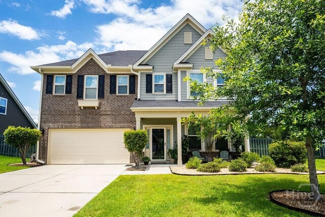 66 Tarbert Cut Cut, Richmond Hill, GA 31324 - view of front of house with concrete driveway, a garage, and brick siding
